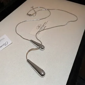 Minimalist silver long snake chain necklace with double waterdrop pendants for women