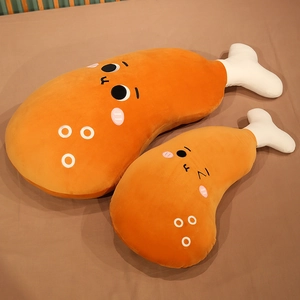 Detail of two-piece cartoon chicken leg plush pillow covers in orange and white