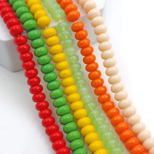 Close-up of colorful 8x5mm glass abacus beads for DIY jewelry making in various vibrant colors