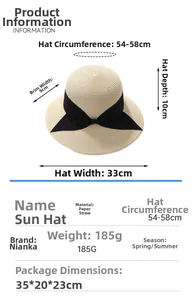 Detailed view of cream straw hat featuring a black bow ribbon and size specifications