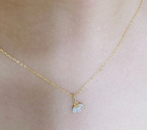 Close-up of a gold S925 sterling silver necklace with three marquise diamond leaf pendants