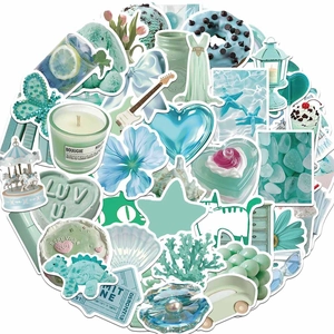 Close-up of assorted mint green and light blue waterproof stickers with floral patterns