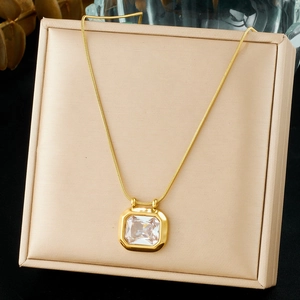Detail of vintage square crystal pendant on gold snake chain jewelry display