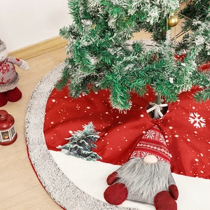 Burlap Christmas tree skirt with 3D gnome design and white faux fur trim on wood floor