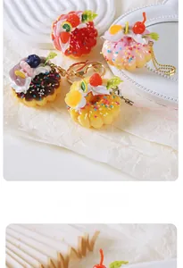 Macro shot of realistic donut charm with cream, sprinkles, and fruit toppings