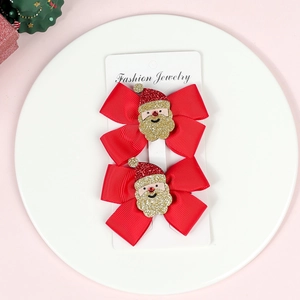 Christmas hair bows for girls with Santa Claus center on white display card