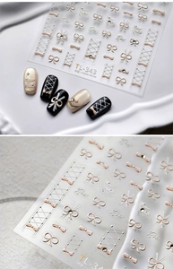 Macro view of 3D embossed bow nail art stickers showing detailed textures and pearl accents