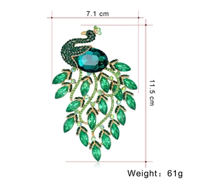 Detailed view of green peacock brooch with alloy base and crystal rhinestones