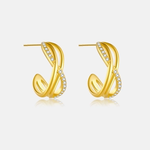 Detail of twisted gold hoop earrings with sparkling micro-inlaid zircon crystals