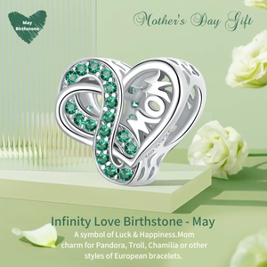 Detailed macro of S925 sterling silver heart charm with green May birthstone and MOM engraving