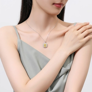 Elegant S925 silver necklace with square yellow diamond pendant worn by a model