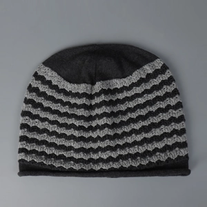 Unisex oversized slouchy beanie featuring black and grey striped wave knit pattern