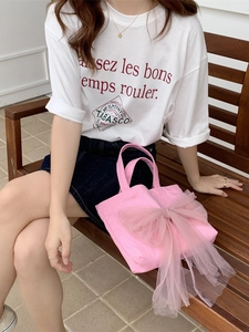 Rosa Canvas-Tragetasche mit großer Netzschleife für einen süßen und verspielten Look