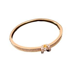 18K gold-plated oval bangle with horseshoe clasp and sparkling cubic zirconia stones
