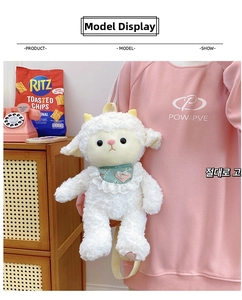 Detail view of a white curly plush sheep backpack with floral scarf on a model