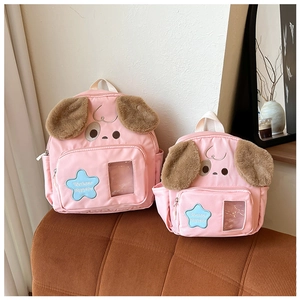 Detail view of pink cute puppy backpacks in two sizes with plush ears and star embroidery