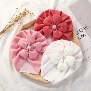 Soft velvet baby turbans with large pearl flowers in red, pink and white colors