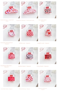 Detailed grid of twelve romantic heart pattern hair claws in pink and red finishes