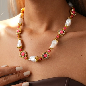 Detail of vintage flower sweater chain with pearls, pink beads and crystals for women