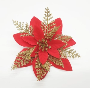 Close-up of a red Christmas poinsettia with gold glitter petals on white background