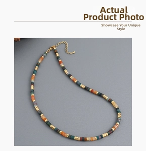 Detail of bohemian colorful stone beaded necklace with golden spacers and lobster clasp