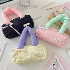 Ins style quilted contrast color cosmetic bags and stationery cases in a desktop setting