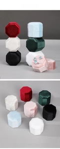 Macro detail of octagonal velvet jewelry boxes showing multiple colors and interior slots