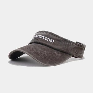 Detailed view of dark grey washed cotton sun visor with white INTERESTED embroidery