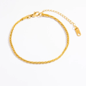 Detailed macro view of 18k gold plated twisted rope chain with lobster clasp and extender