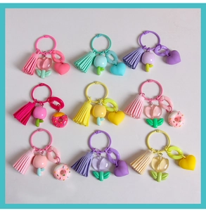 Colorful resin tulip flower keychains with tassels and heart charms in assorted bright colors