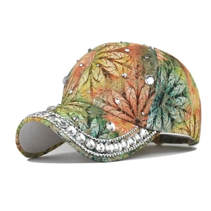 Detailed side view of colorful printed baseball cap with sparkling rhinestone embellishments