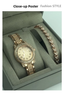 Detail of rose gold jewelry set with rhinestone watch and heart bracelet in a gift box