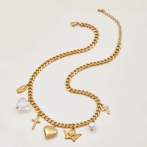 Detail of gold Cuban link bracelet with coin, heart charms and pearl on white background