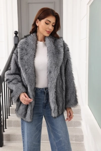 Detail of grey faux fur coat featuring a plush texture and stylish oversized lapels