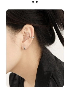 Close-up of minimalist S925 silver hoop earrings and ear cuff set on a model