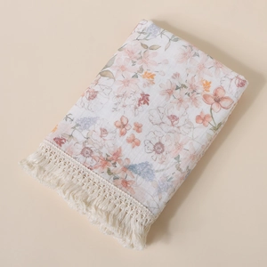 Soft double-layer cotton gauze baby blanket with floral print and fringe detail