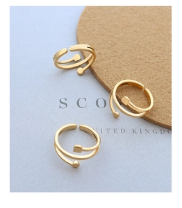 Detail of 18K gold-plated double-layer ring with geometric circle and square elements