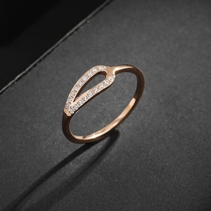 Minimalist rose gold titanium steel ring featuring hollow leaf design and pave zircon