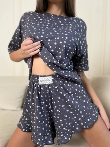 Detailed view of the ruffle hem floral shorts and ribbed fabric of the pajama set