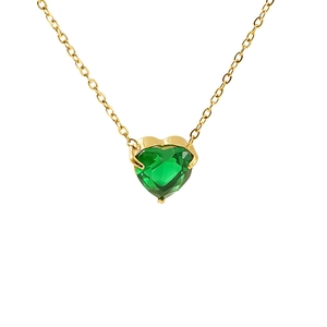 Macro detail of heart-shaped green zircon pendant with gold claw setting and chain