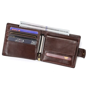 Detail of dark brown leather wallet showing multiple card slots and red stitching