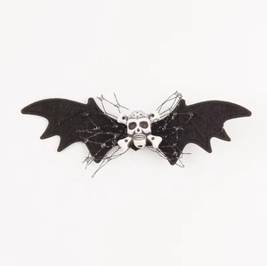 Halloween bat wing hair clip with white skull detail on a clean white background