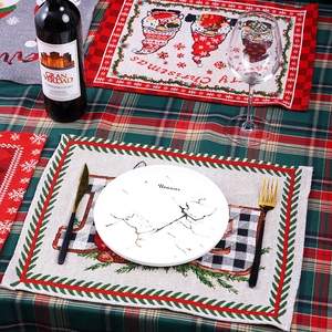 Close-up of woven Christmas placemat with faceless gnome and Merry Christmas text