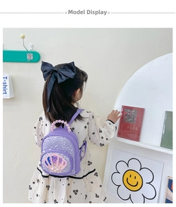 Detail of purple sequin toddler backpack with shell motif and pearl bead handle