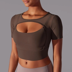 Detail of dark brown mesh cutout short sleeve sports crop top for yoga and fitness