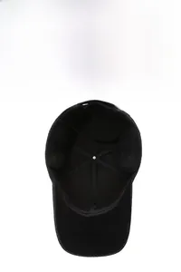 Detail view of winter baseball cap featuring warm black fleece lining and fold-down earflaps