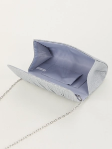 Detailed interior of silver glitter evening clutch with light blue satin lining and chain