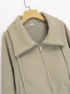 Detail view of khaki fleece jacket with metal zipper and stand-up collar