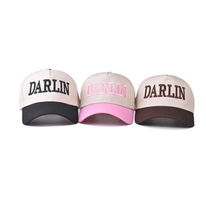 Three cotton baseball caps with DARLIN embroidery in beige, pink, and brown colorblock