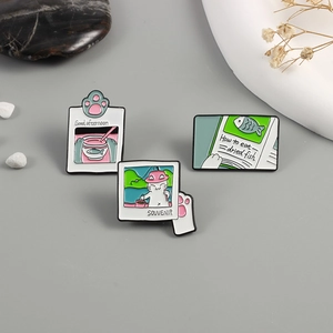 Cute cartoon cat enamel pin set featuring fishing scenes and polaroid style frames